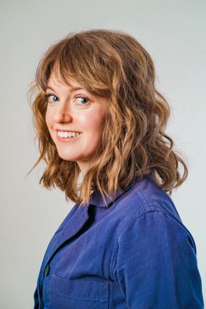 A headshot of Megan Stewart taken by Andrew McInnis